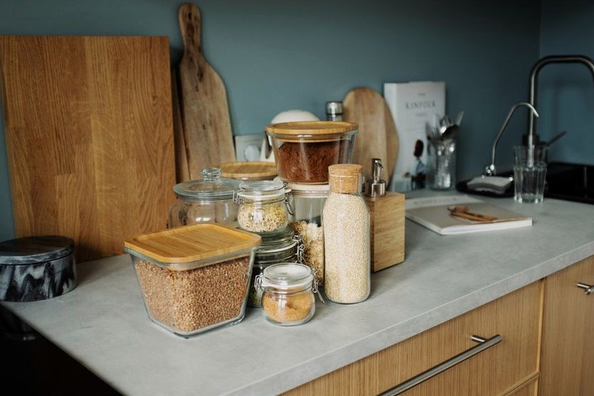 A warm practical kitchen with wood cabinetry